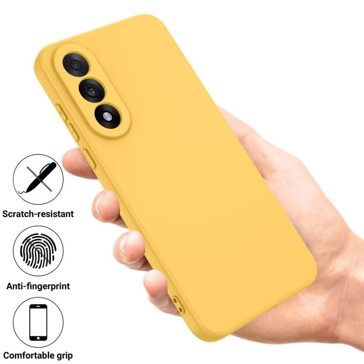 Жовтий силіконовий чохол з протиударним захистом у руці 