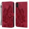 Чохол-книжка в стилі Retro м'яка фактура з тисненням Butterflies та магнітним хлястиком на Samsung Galaxy A07 4G / A06 4G - червоний